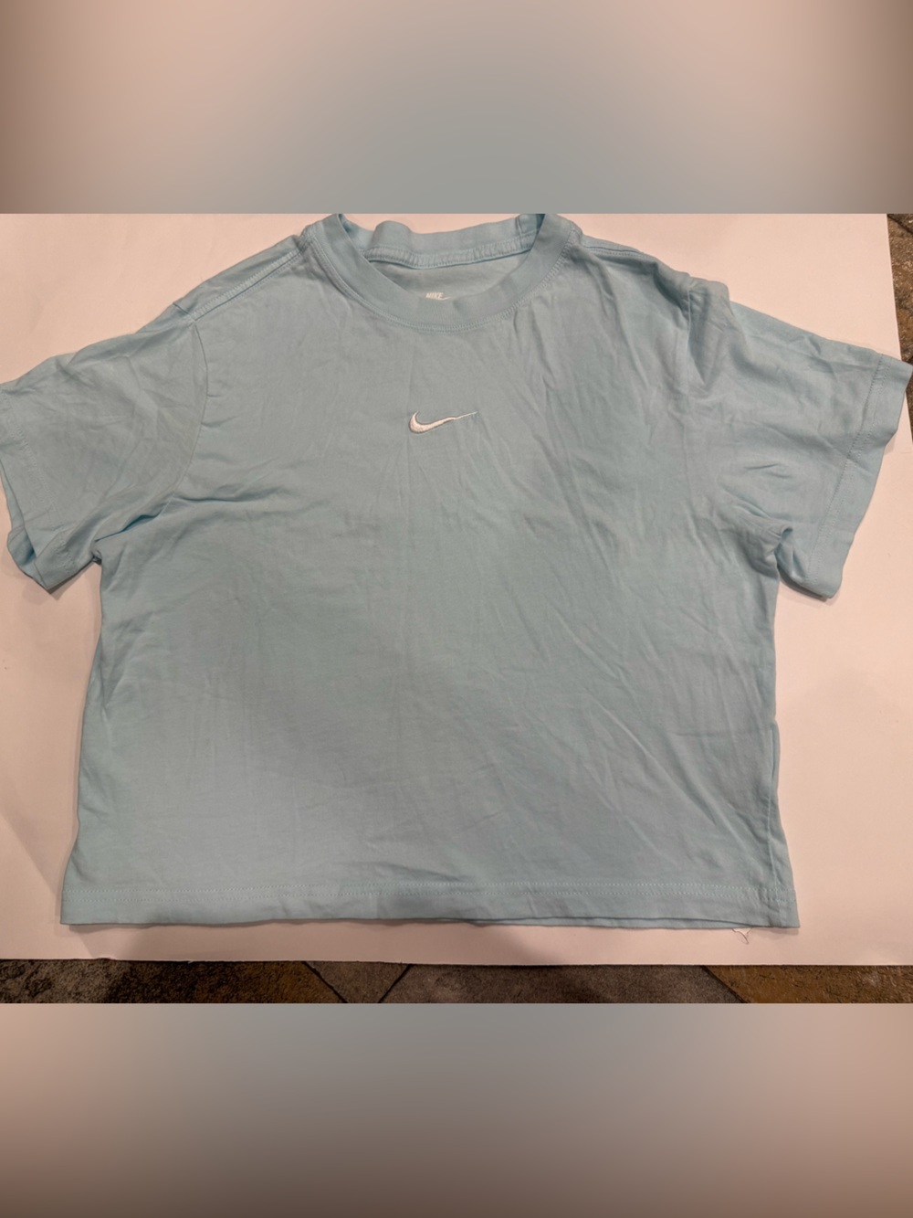 Nike Women’s Light Blue Cropped Swoosh Tee